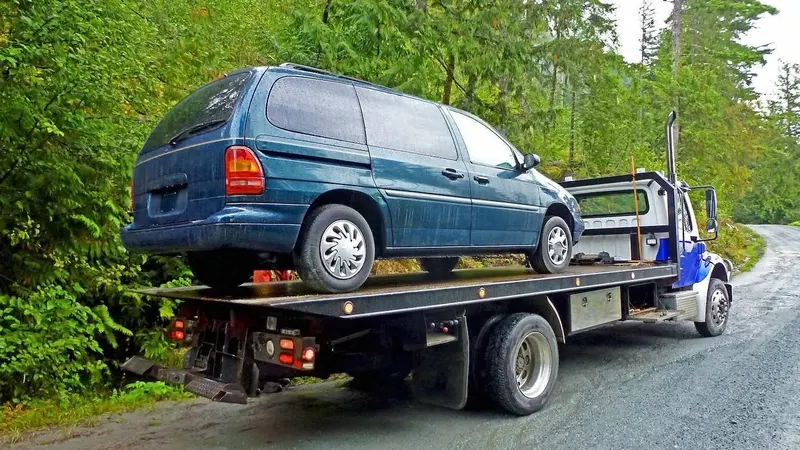 Saskatoon flatbed towing a cargo van