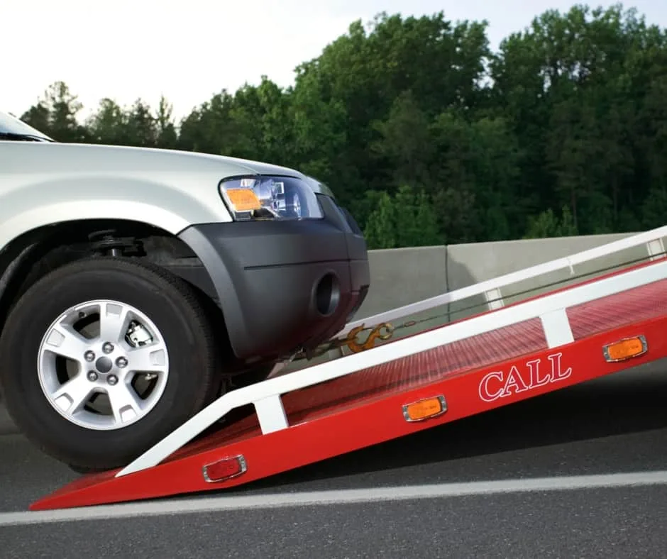 Saskatoon tow truck loading a vehicle on a residential street