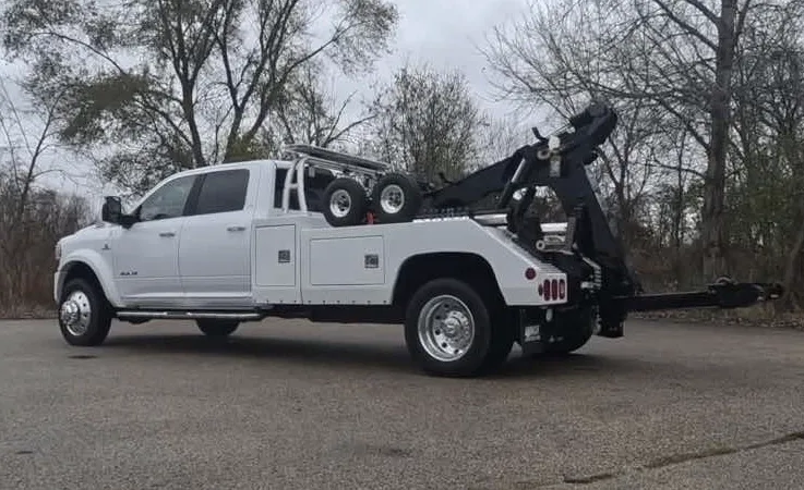 Saskatoon wrecker equipment securing damaged vehicle